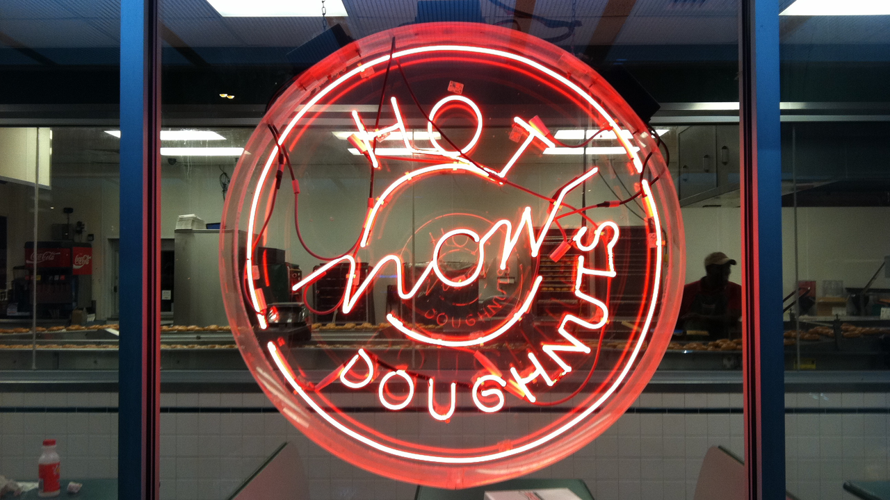 Krispy Kreme "Hot Now Doughnuts" neon sign — iconic NC food culture